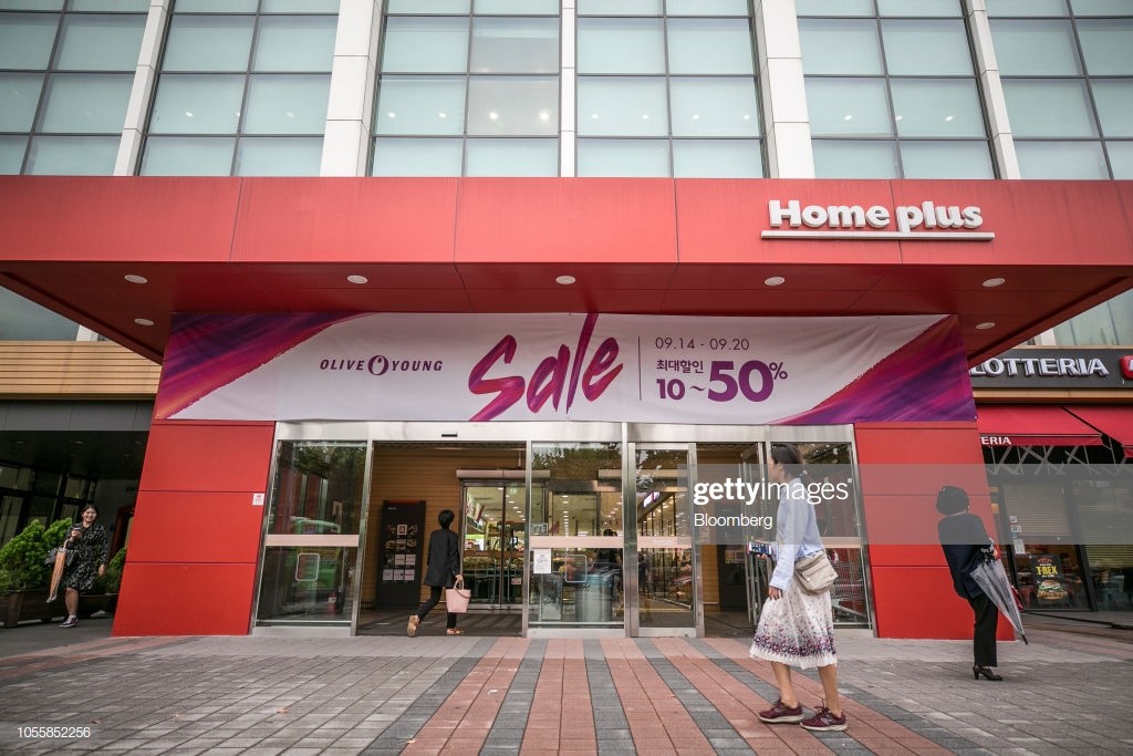 Pedestrians walk past a Homeplus Co. store in Seoul, South Korea, on Thursday, Sept. 20, 2018. Lim Il Soon became the chief executive officer of Homeplus, a $9.7-billion-a-year discount-store operator, in 2017 after she built a reputation among buyout funds for being a turnaround wizard. Prior to that, she had been chief financial officer at four companies since 1998, a rarity in a country with the lowest female representation in the OECD. Photographer: Jean Chung/Bloomberg via Getty Images